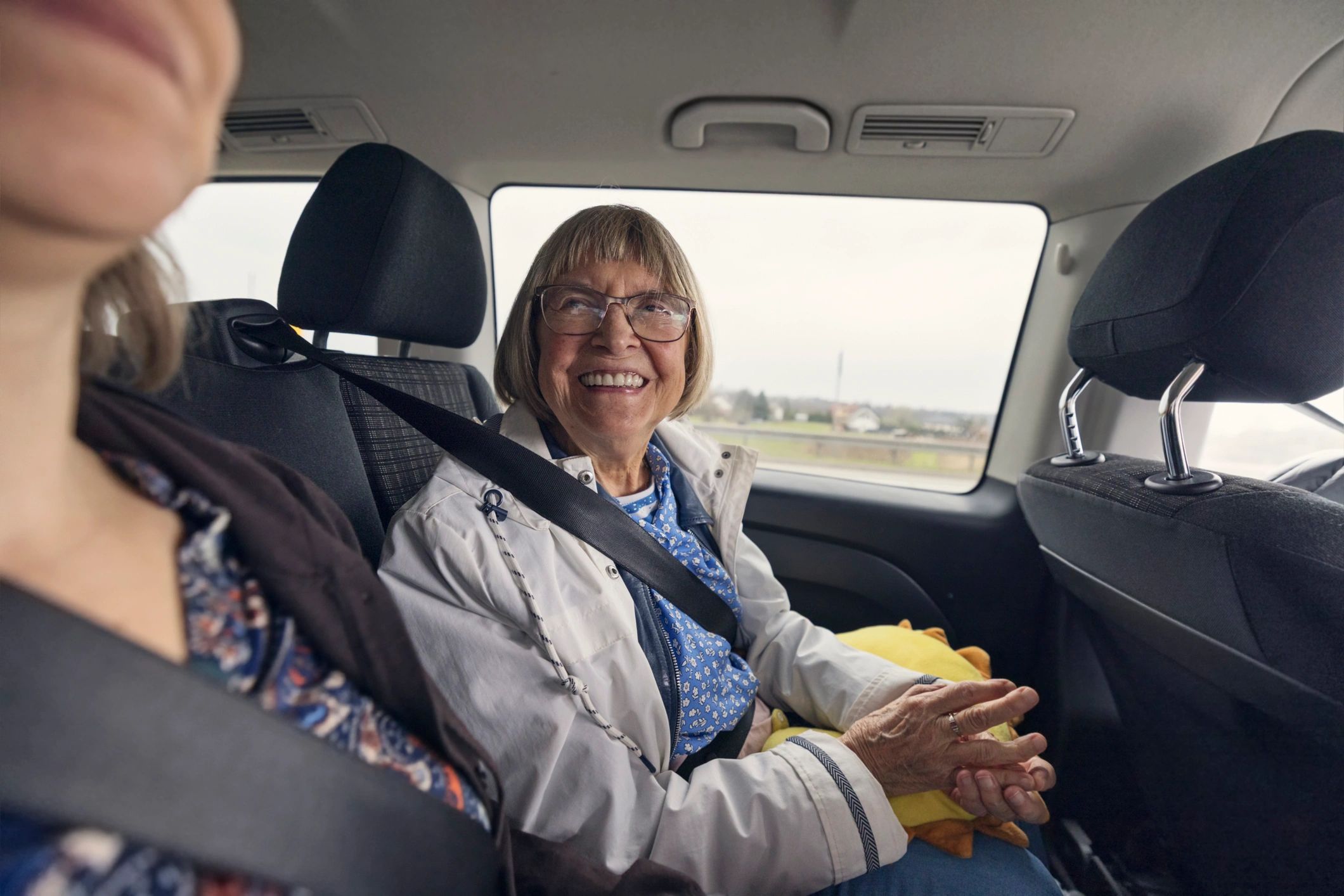 Senior woman traveling safely with family support